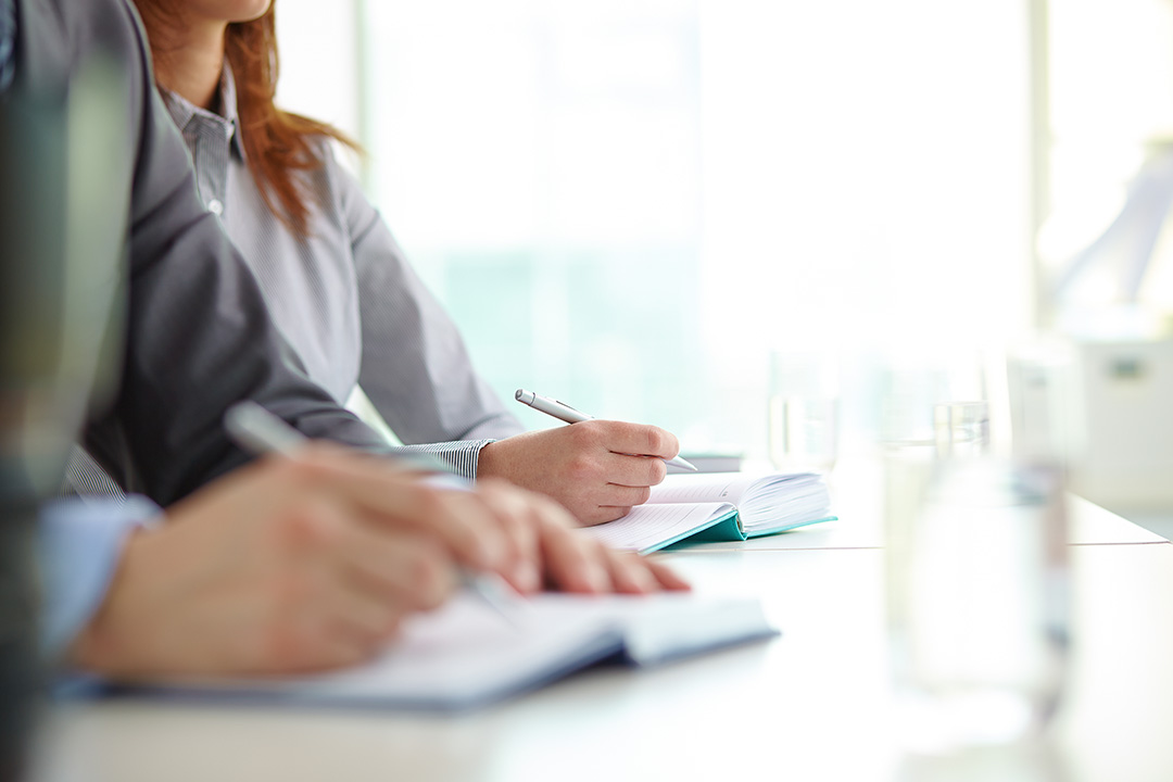 Closeup of woman studying in classroom